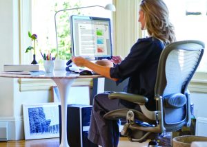 Woman sitting at desk working from home